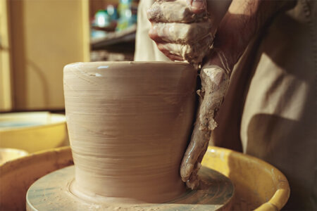 creating-a-jar-or-vase-of-white-clay-close-up-5QXADWJ-450x300